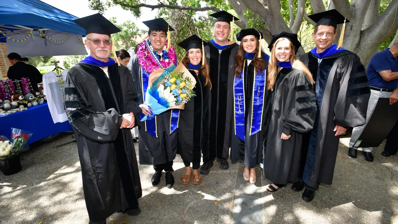 Students and faculty at graduation ceremony 2023