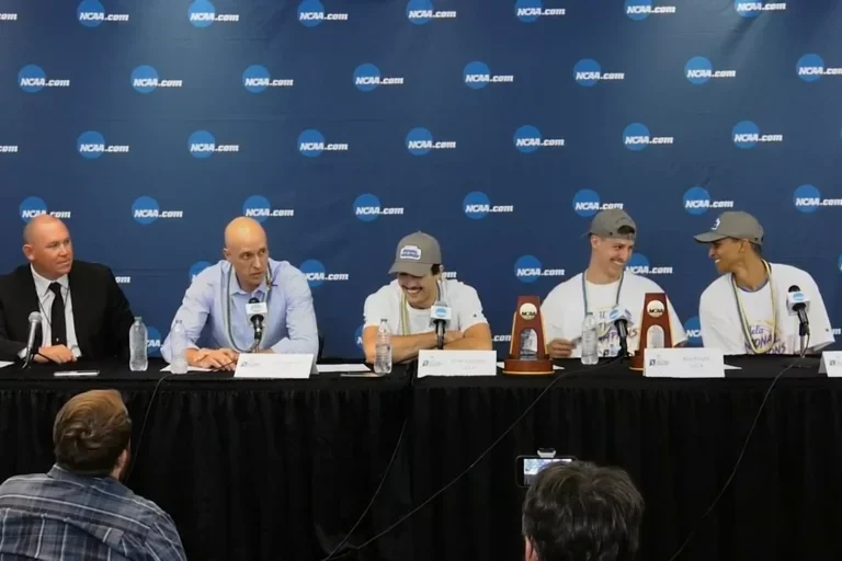 Panel of head coach and players being interviewed 