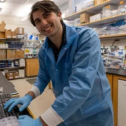 James Brown smiling with lab in the background.