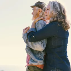 Women embracing a man 